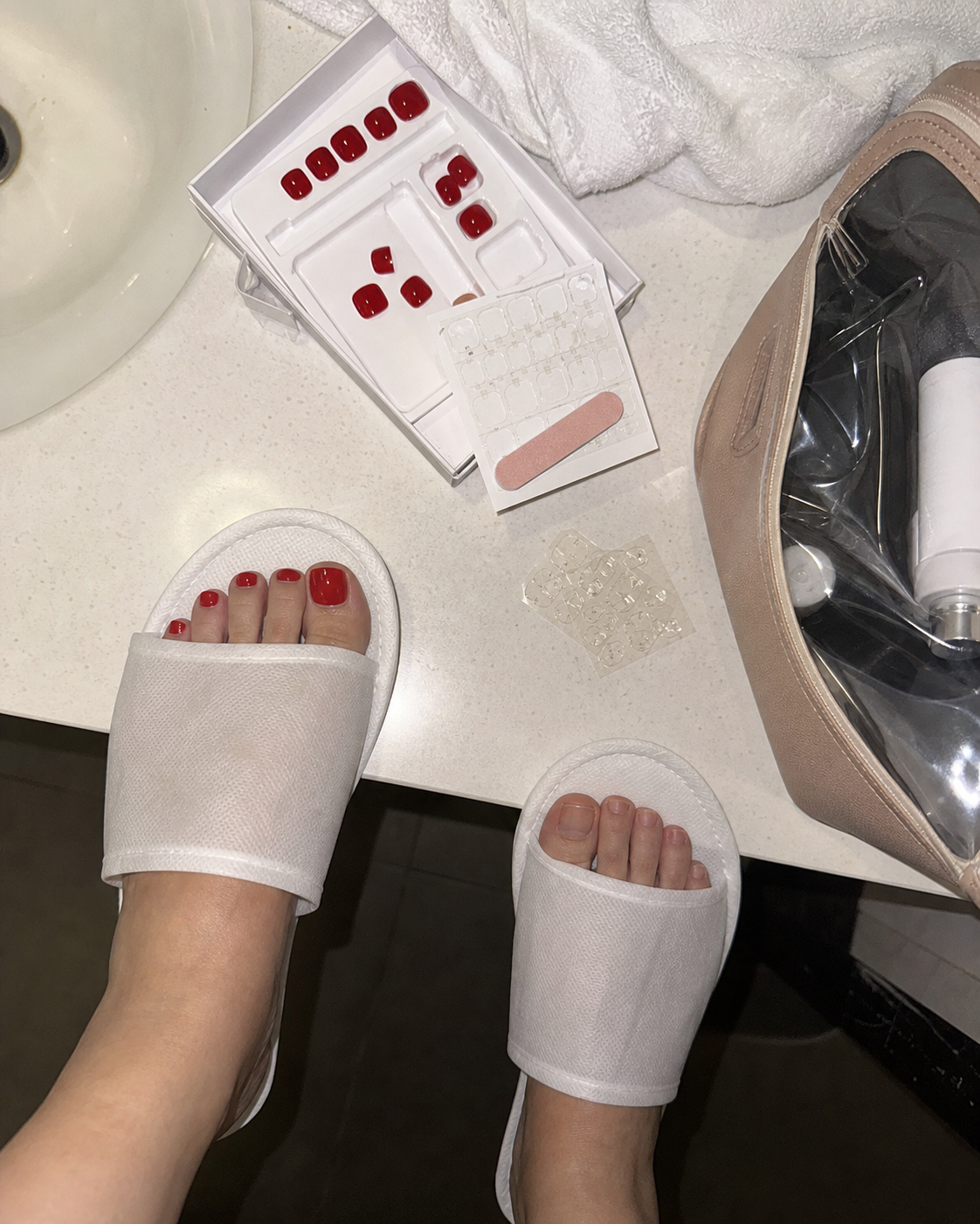 Hotel bathroom kit photo with press-on nail tray and tabs